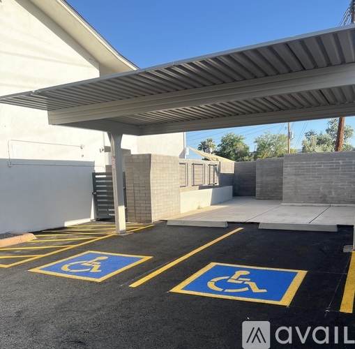 A parking lot with two handicap parking spaces.