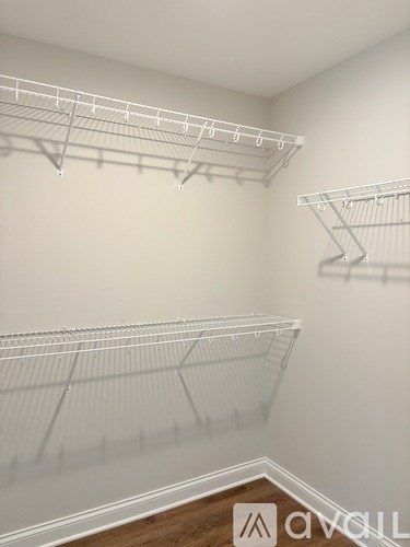 Empty white shelves in a room.