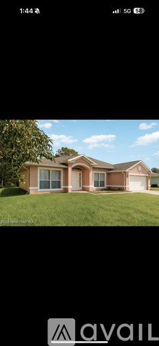 A house with a brown roof and a white door is shown.