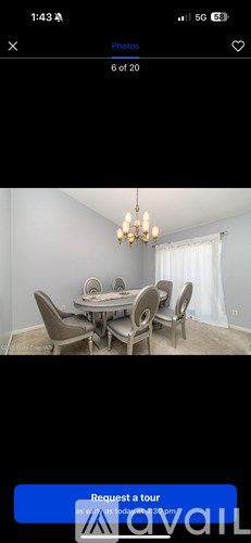 A dining room with a table set for six.