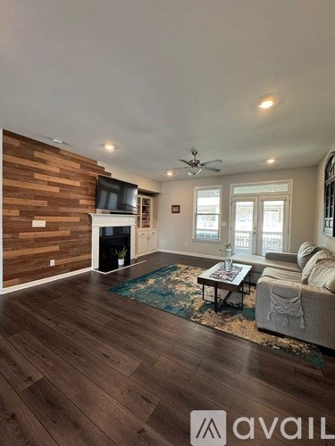 A living room with a fireplace and a couch.