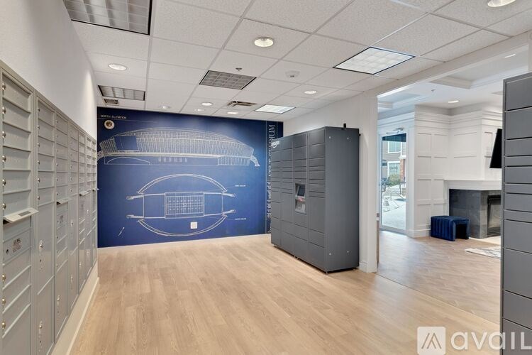 A room with a blue wall and wooden flooring.