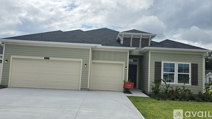A house with two garages is for sale.