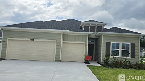 A house with two garages is for sale.