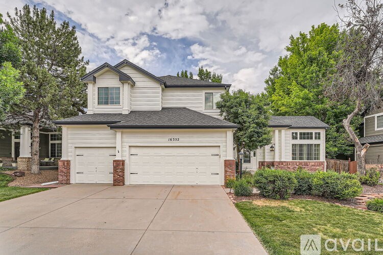 A house with a garage is for sale.