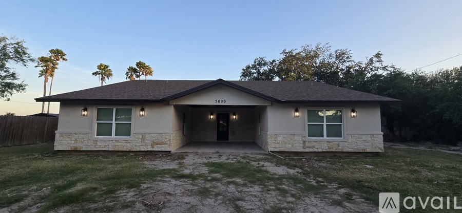 A house with a brown roof and a garage is available for sale.