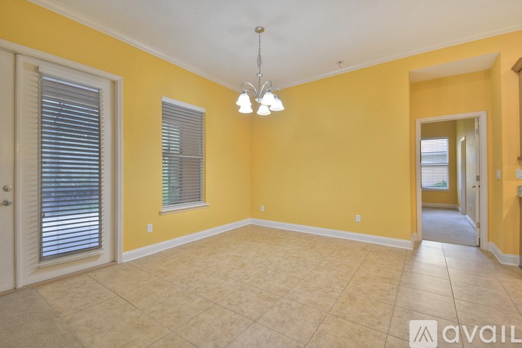 A room with yellow walls and a tiled floor.
