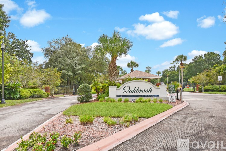 A sign that says Oakbrook in front of a building.