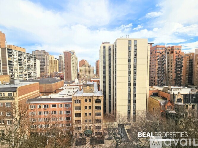A cityscape with buildings of various heights and architectural styles.