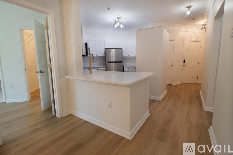 A kitchen area with a counter and cabinets.