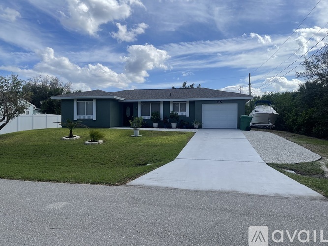 A house with a driveway in front of it.