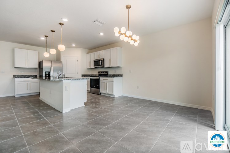 A spacious kitchen with a large island and modern appliances.