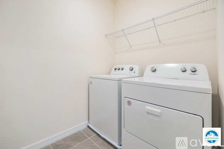 A laundry room with a washer and dryer.