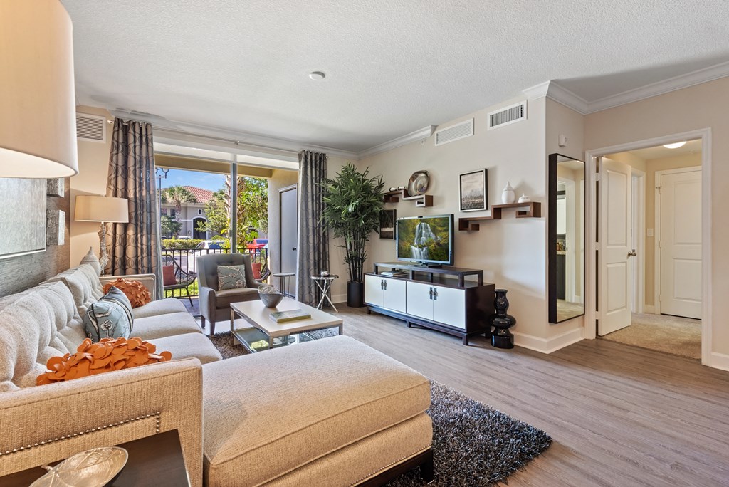 a living room with a couch and a tv
