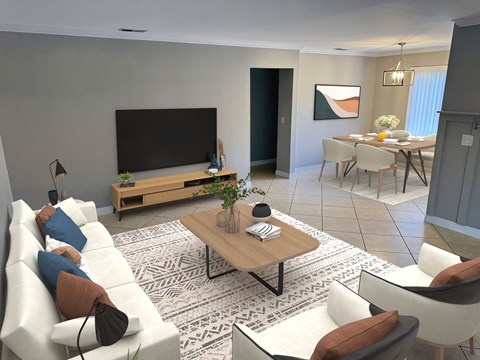 A modern living room with a white sofa, a wooden coffee table, and a television on a wooden stand.