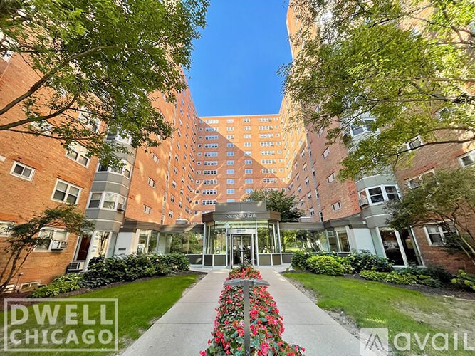 A building with the sign Dwell Chicago in front of it.