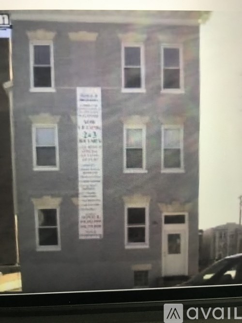 A building with a sign that says "available" in the bottom right corner.