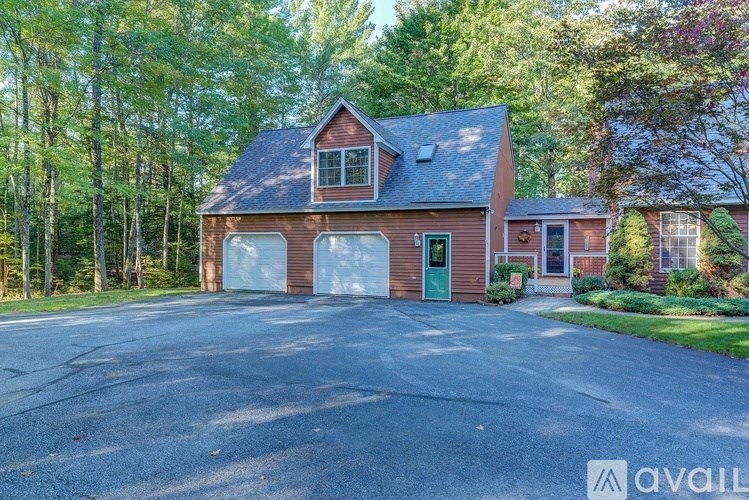 A house with a garage is available for sale.