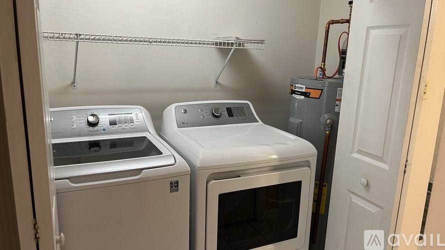 A white oven and stove are in a small kitchen.