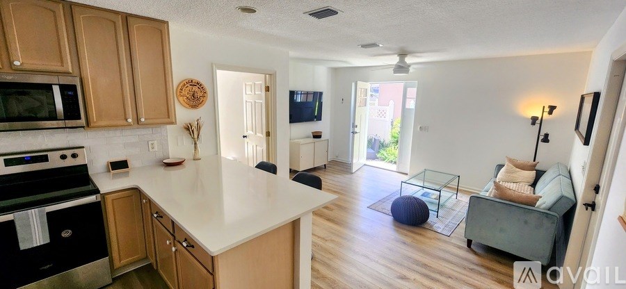 A kitchen with wooden cabinets and a white countertop.