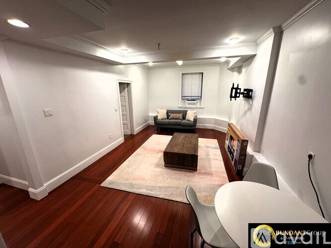 A staircase with a chandelier at the top.