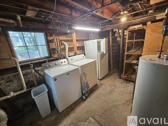 A room with a washer and dryer in it.