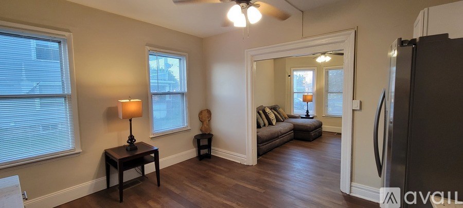 A kitchen with stainless steel appliances and white cabinets.