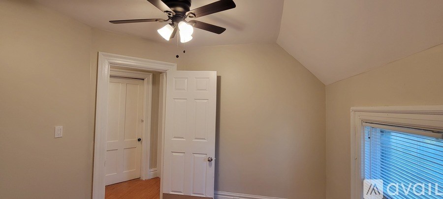 A bathroom with a white sink and a white toilet.