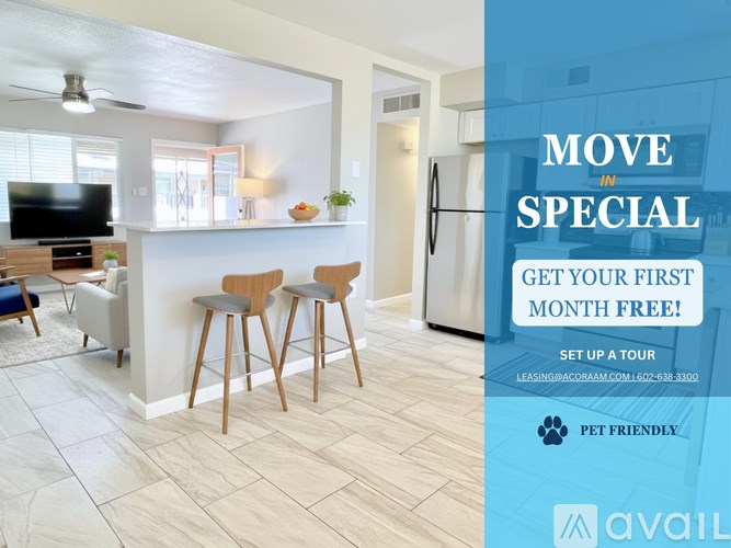 A living room with a bar stool and a kitchen area in the background.