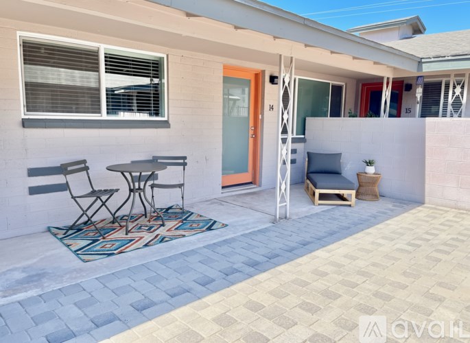 A patio with a table and chairs is shown.