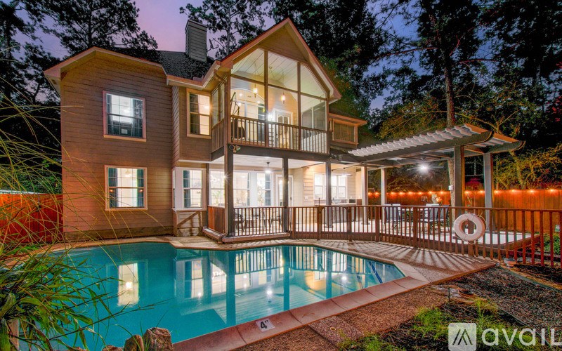 A house with a pool in the backyard.