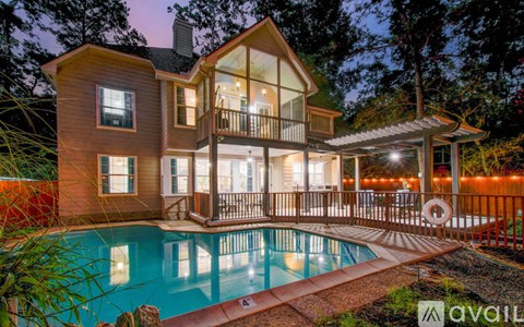 A house with a pool in the backyard.