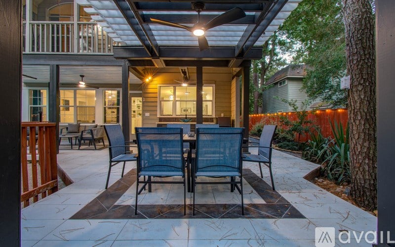 A patio with a table and chairs is shown.
