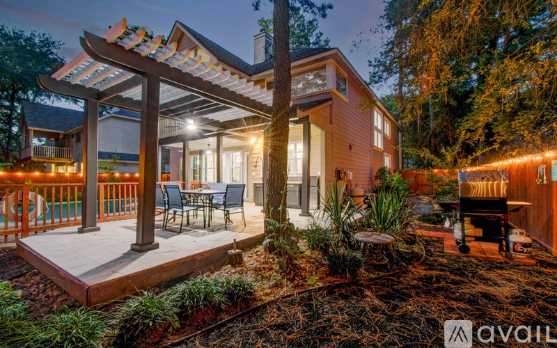 A house with a deck and patio area is available for purchase.