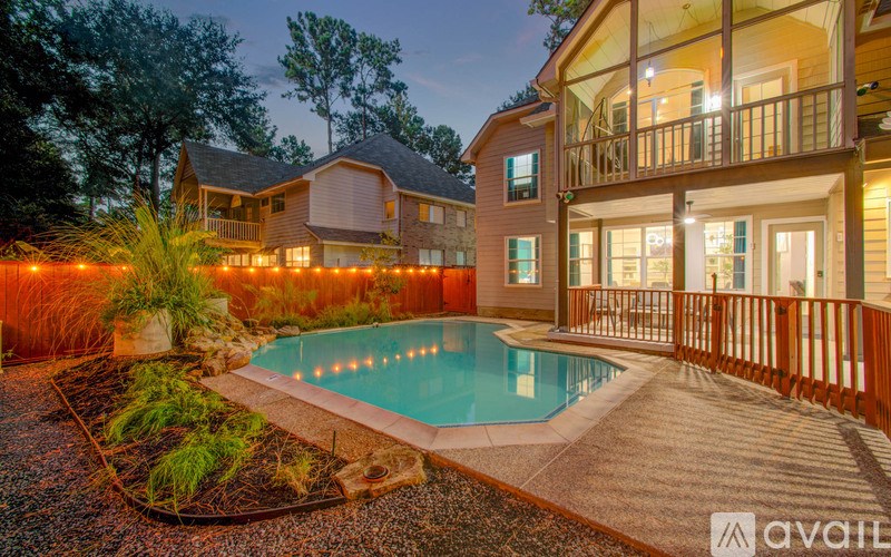 A house with a pool in the backyard.