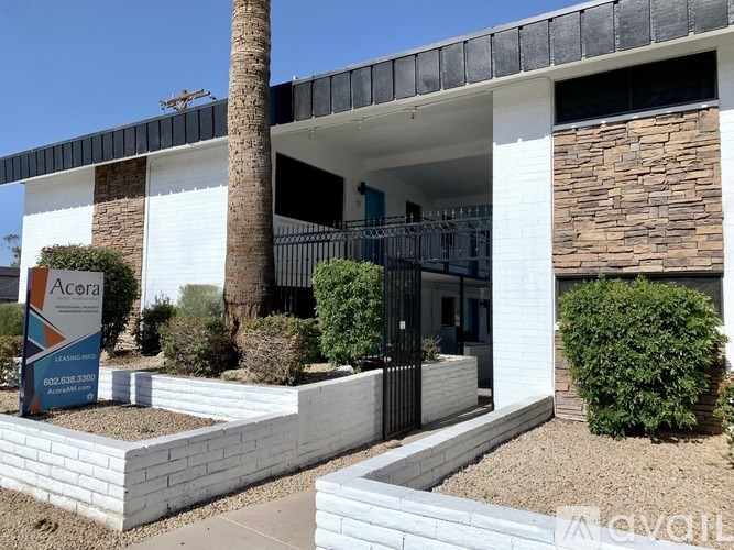 A modern house with a sign in front that says "Acora".