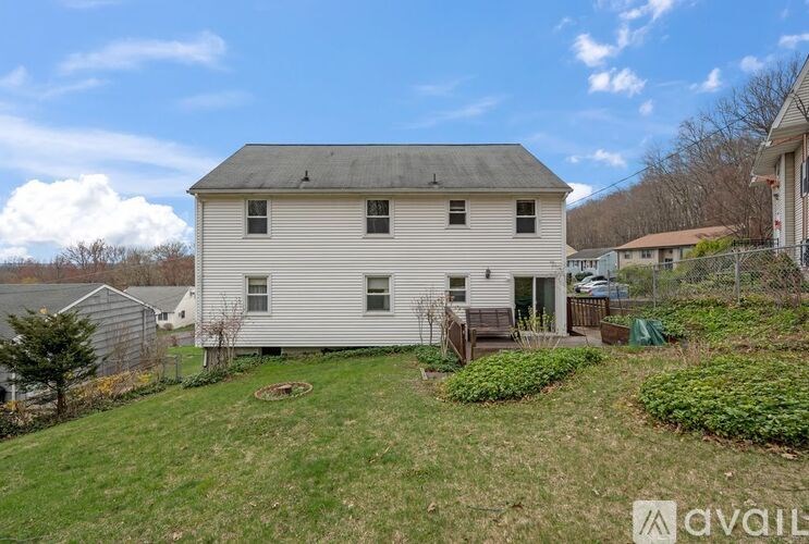 A house with a lawn in front of it.