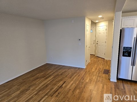 A kitchen area with a refrigerator on the right side.