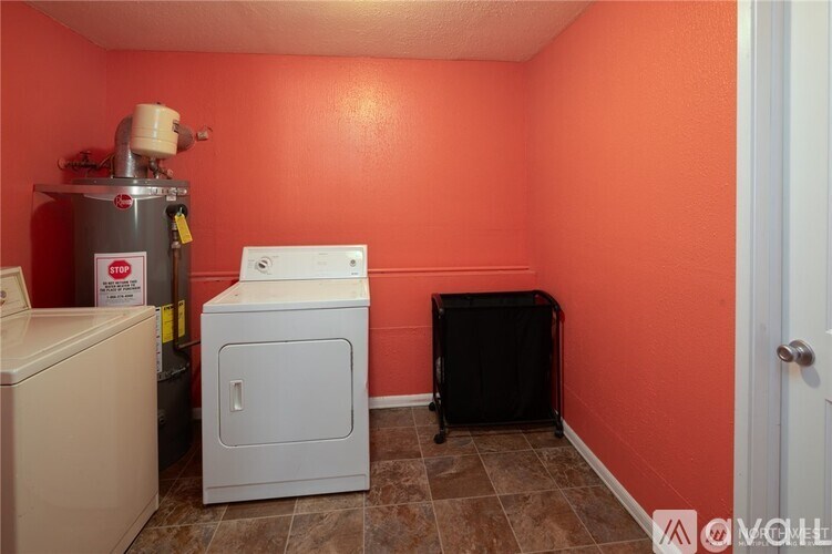 A small room with a washer and dryer.