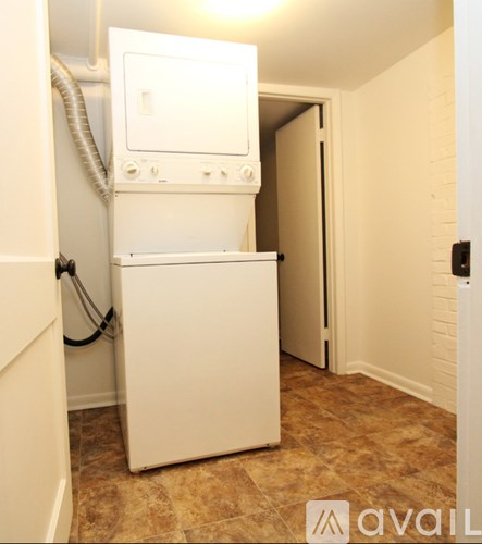 A white dishwasher and dryer in a small room.