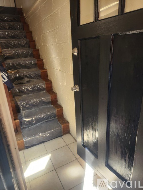 A set of stairs covered in plastic wrap.
