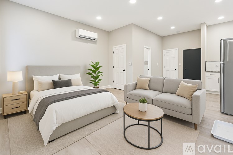 A kitchen with white cabinets and stainless steel appliances.