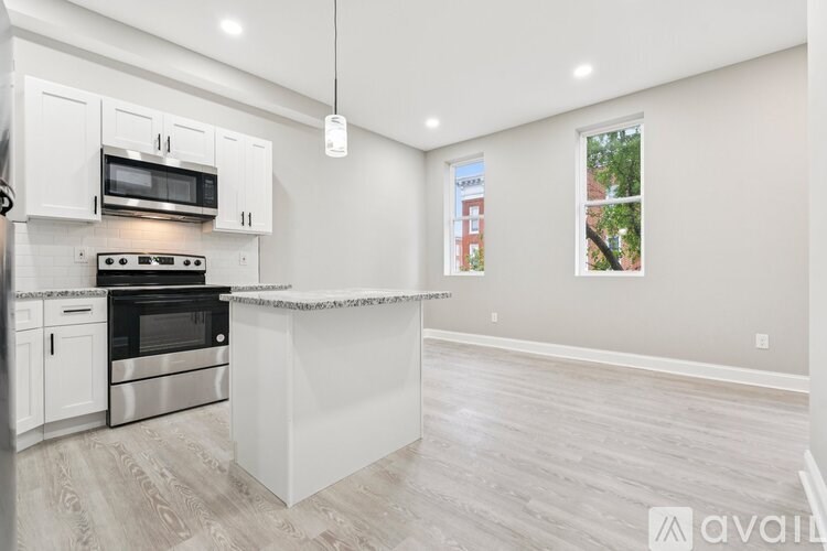 A modern kitchen with a large island in the middle.