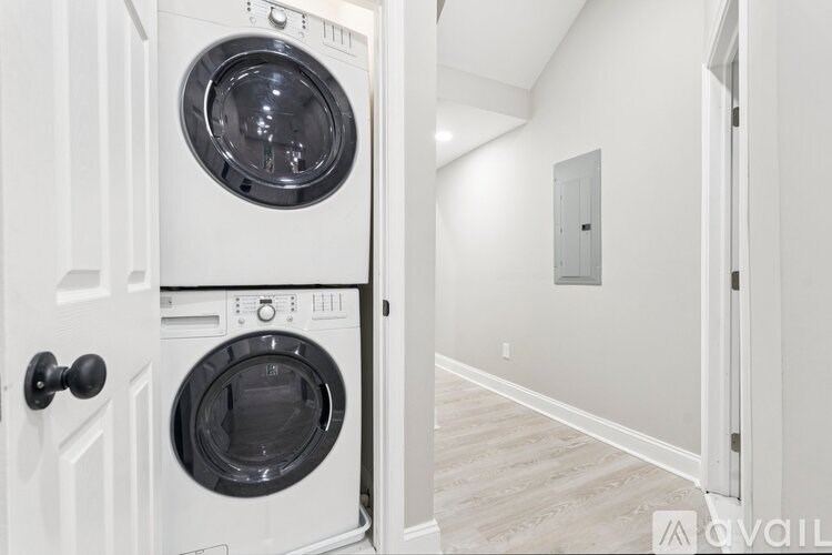 A white door with a washing machine in it.