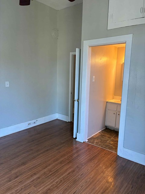 A room with a white door leading to another room.