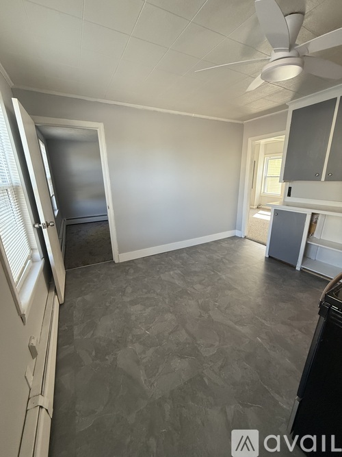 A kitchen with a refrigerator, stove, and microwave.