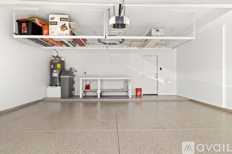 A room with a white ceiling, a white bench, and a white floor.