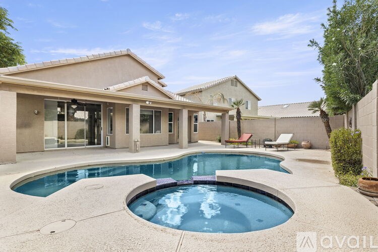 A house with a pool in the backyard.