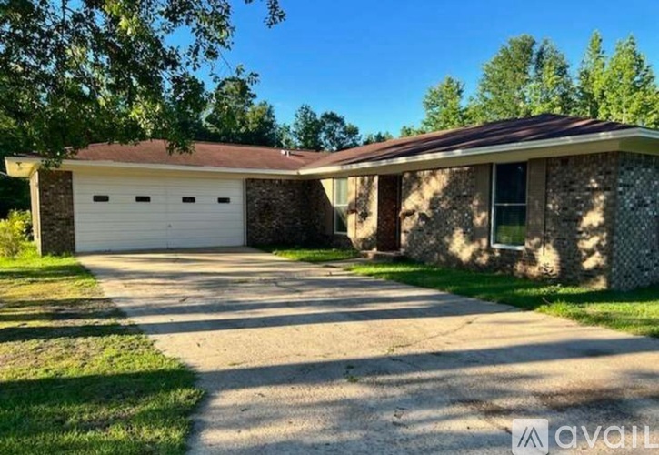 A house with a garage is for sale.