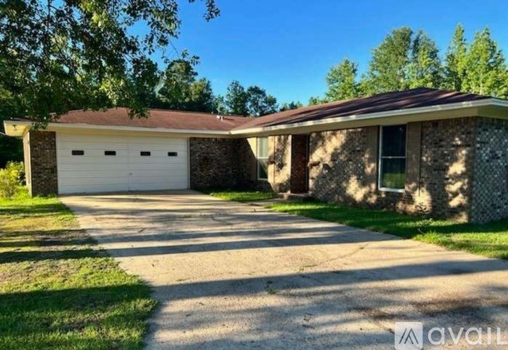 A house with a garage is for sale.